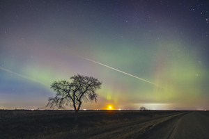 Moonrise Under Northern Lights