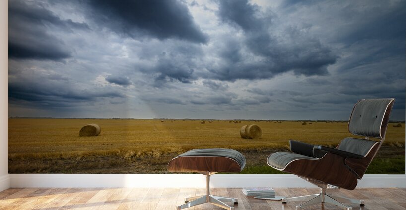 Hay Bales Under a Cloudy Sky Wall Murals